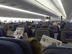 Travelers on Airplane in Asia