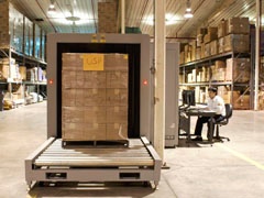 X-ray Operator Screening Cargo in a Warehouse