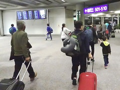 Passengers Navigating Through an Airport